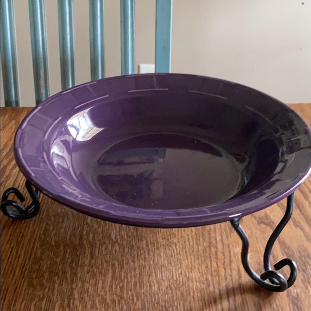 Longaberger pottery pasta dish with iron stand.